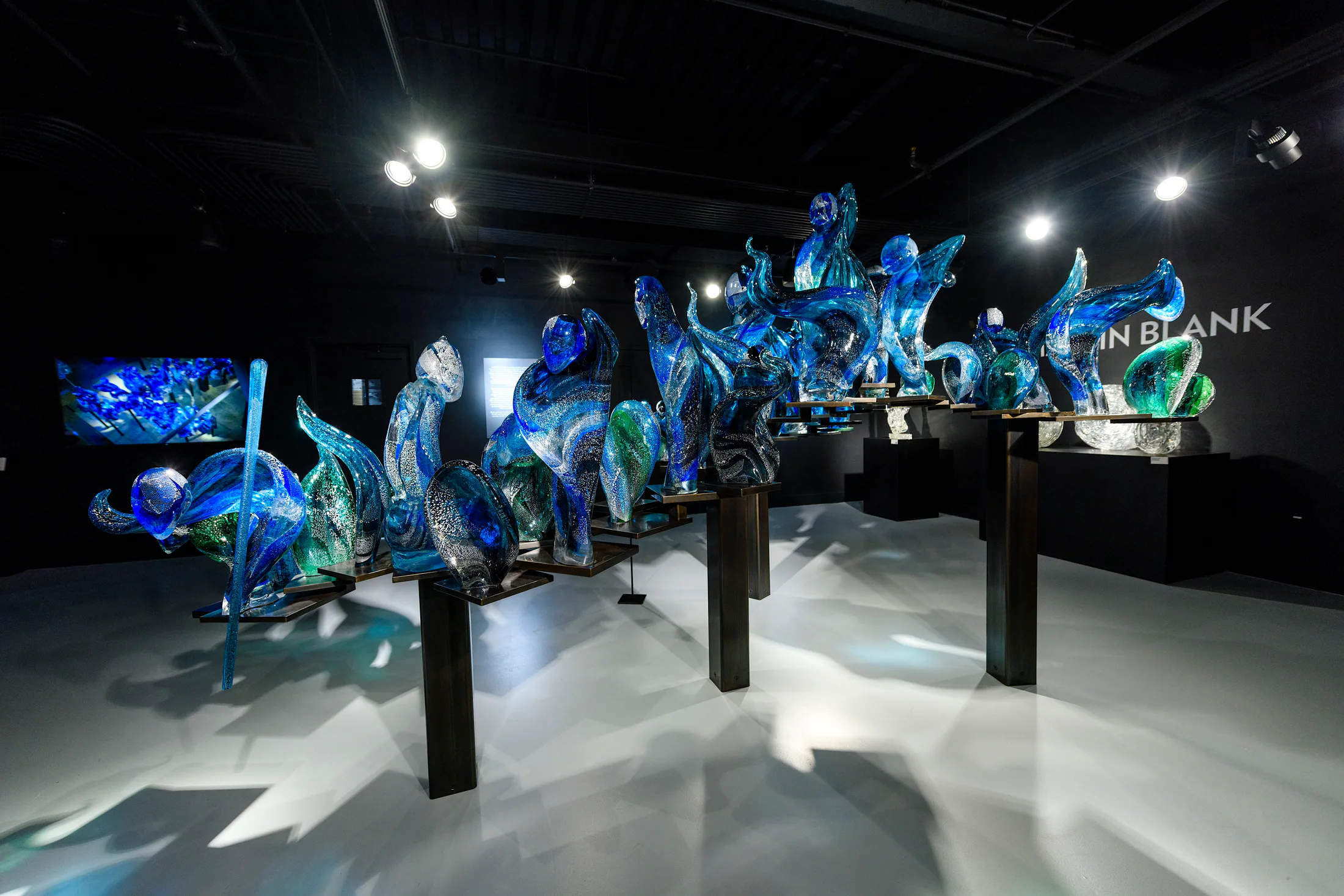 Blue and green contemporary glass installation at Imagine Museum